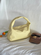 Borsa a spalla effetto “puff” in tonalità macaron