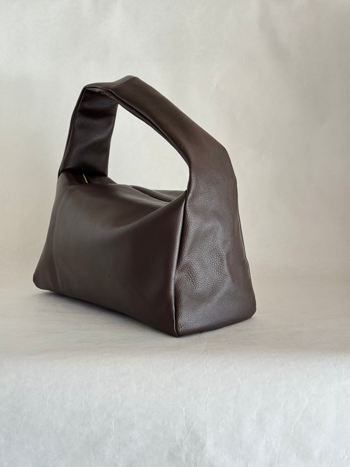 Borsa a spalla effetto “puff” in tonalità macaron
